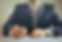 crop-businessman-signing-contract-in-off